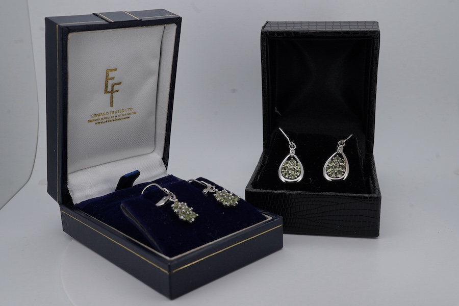 Two pairs of modern 375 white metal and gem set drop earrings, including pear shape, 30mm and star cluster, gross weight 4.4 grams. Condition - fair to good